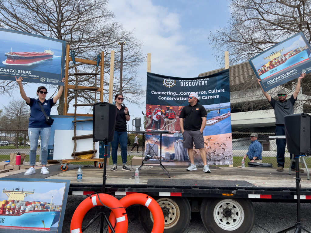 Errin Howard of RiverWorks Discovery, Taylor Martin of Associated Terminals, Captain Kenny Brown of Maritime Throwdown and Lloyd Trosclair of Turn Services on stage at the Junior Achievement Maritime Day event.