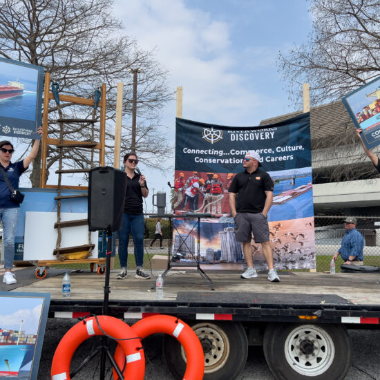 Errin Howard of RiverWorks Discovery, Taylor Martin of Associated Terminals, Captain Kenny Brown of Maritime Throwdown and Lloyd Trosclair of Turn Services on stage at the Junior Achievement Maritime Day event.